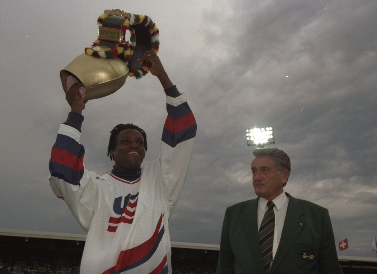 Cowbells have many different uses and are not just for skiing fans. Here American sprinter Carl Lewis of the USA is presented in 1997 with a huge cow-bell by promoter Andreas Brugger at the IAAF Weltklasse Grand Prix at the Letzigrund Stadium in Zurich, Switzerland.