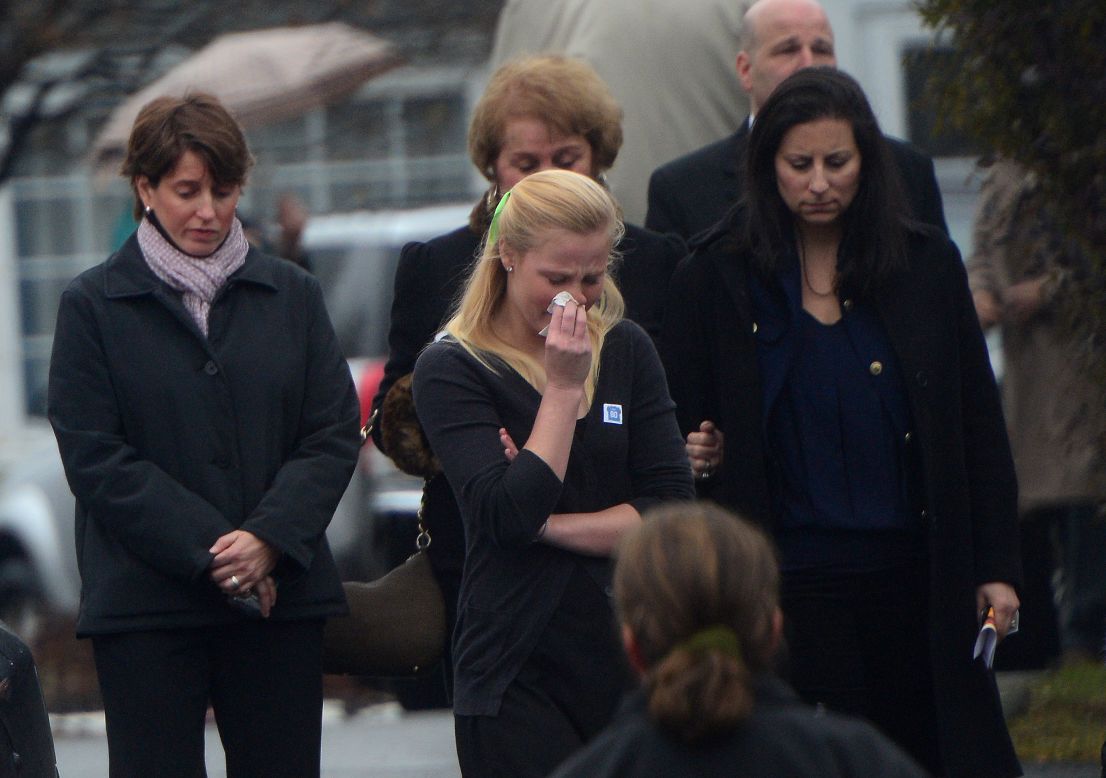 Mourners grieve the death of Jack Pinto, 6, on December 17.