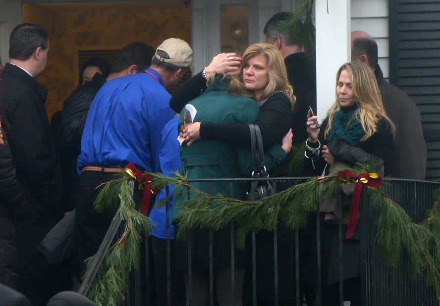 Mourners console each other after attending the funeral for Jack Pinto, 6, on December 17.