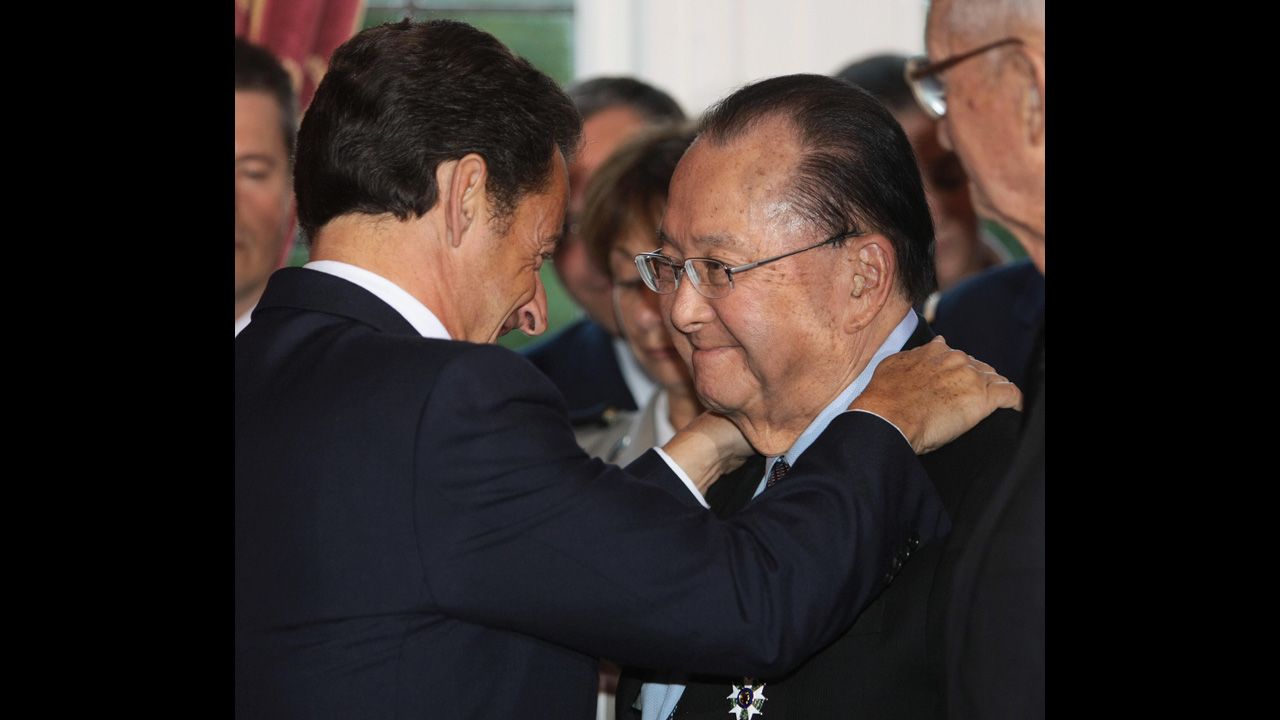 French President Nicolas Sarkozy, left, embraces Inouye after awarding him the Legion d'honneur in Washington on November 6, 2007. Sarkozy decorated seven U.S .World War II veterans at the event.