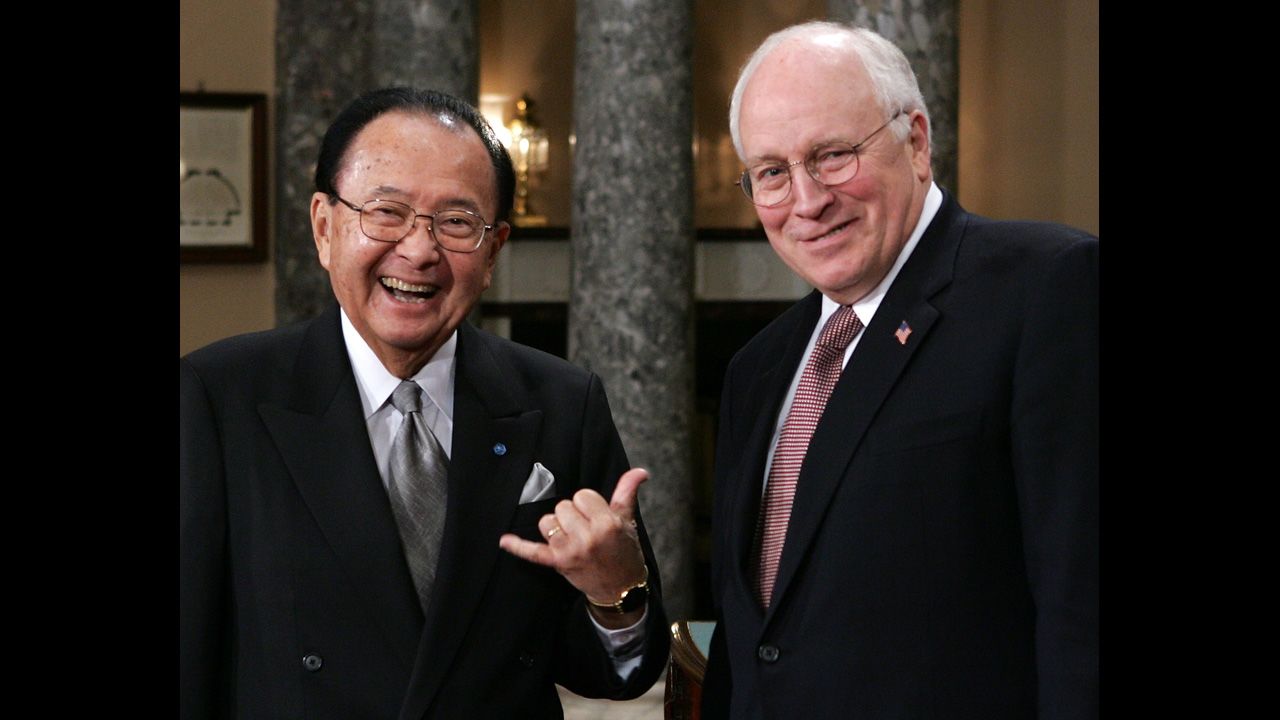 Inouye, left, poses for photographers with Vice President Dick Cheney during the reenactment of a swearing-in ceremony on January 4, 2005.