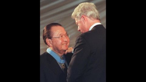 Former U.S. President Bill Clinton, right, congratulates Inouye after awarding him the Congressional Medal of Honor on June 21, 2000, at the White House.