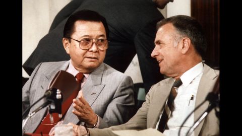 Inouye, left, was chairman of the Senate committee that held hearings on the Iran-Contra affair. Here, he talks with House committee Chairman Lee Hamilton on July 13, 1987.