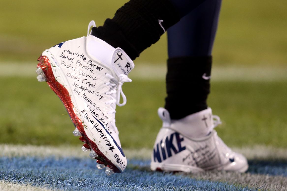 Running back Chris Johnson of the Tennessee Titans wears cleats bearing the names of the victims of the Newtown, Connecticut, school shooting before the game against the New York Jets on Monday, December 17, in Nashville. Check out the action from Week 15 of the NFL and then <a href="http://www.cnn.com/2012/12/06/worldsport/gallery/nfl-week-14/index.html">look back at the best photos from Week 14</a>.