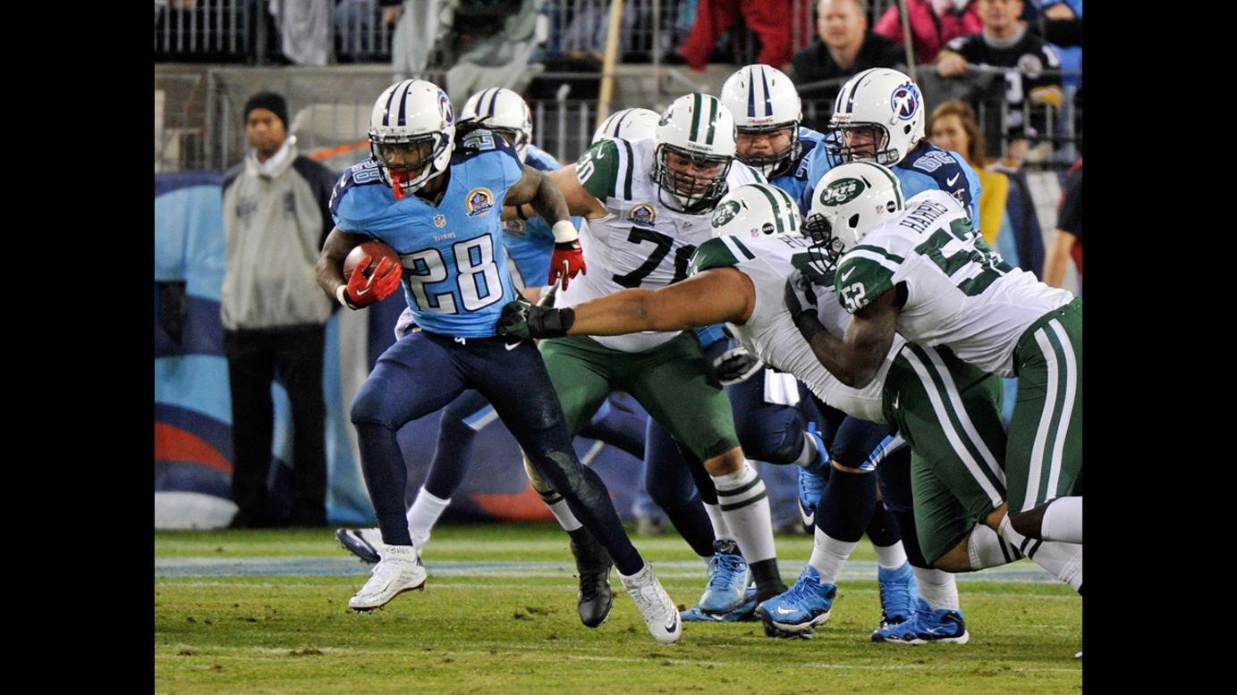 Titans running back Chris Johnson breaks through the defense of the Jets for a 94-yard touchdown run on Monday.