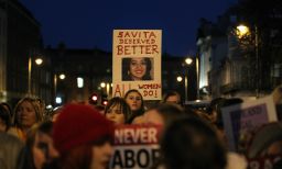 Demonstrators hold placards and candles in memory of Savita Halappanavar in support of legislative change on abortion during a march in Dublin, Ireland, in 2012.