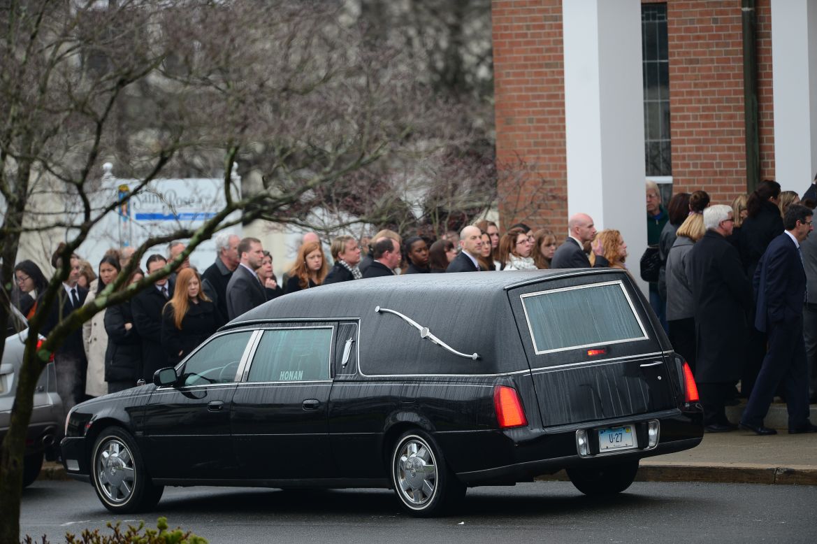 Jessica Rekos' casket arrives at St. Rose of Lima Roman Catholic Church as mourners gather December 18.