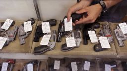 LOCKPORT, IL - JULY 12: A worker stocks pistols being offered for sale at Rinks Gun and Sport in suburban Chicago on July 12, 2010 in Lockport, Illinois. Chicago began enforcing its new gun law today, considered the toughest in the nation. Although Chicago residents can now possess handguns in the city, they are still forced to purchase guns and ammunition in the suburbs because the sale is outlawed in the city. The United States Supreme Court ruled against the old Chicago law, which banned ownership of handguns, because it violated the second amendment. (Photo by Scott Olson/Getty Images)