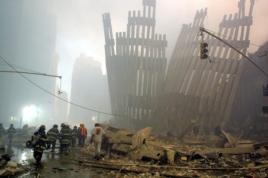 Firefighters make their way through the rubble of the World Trade Center on September 11, 2001. (file photo)