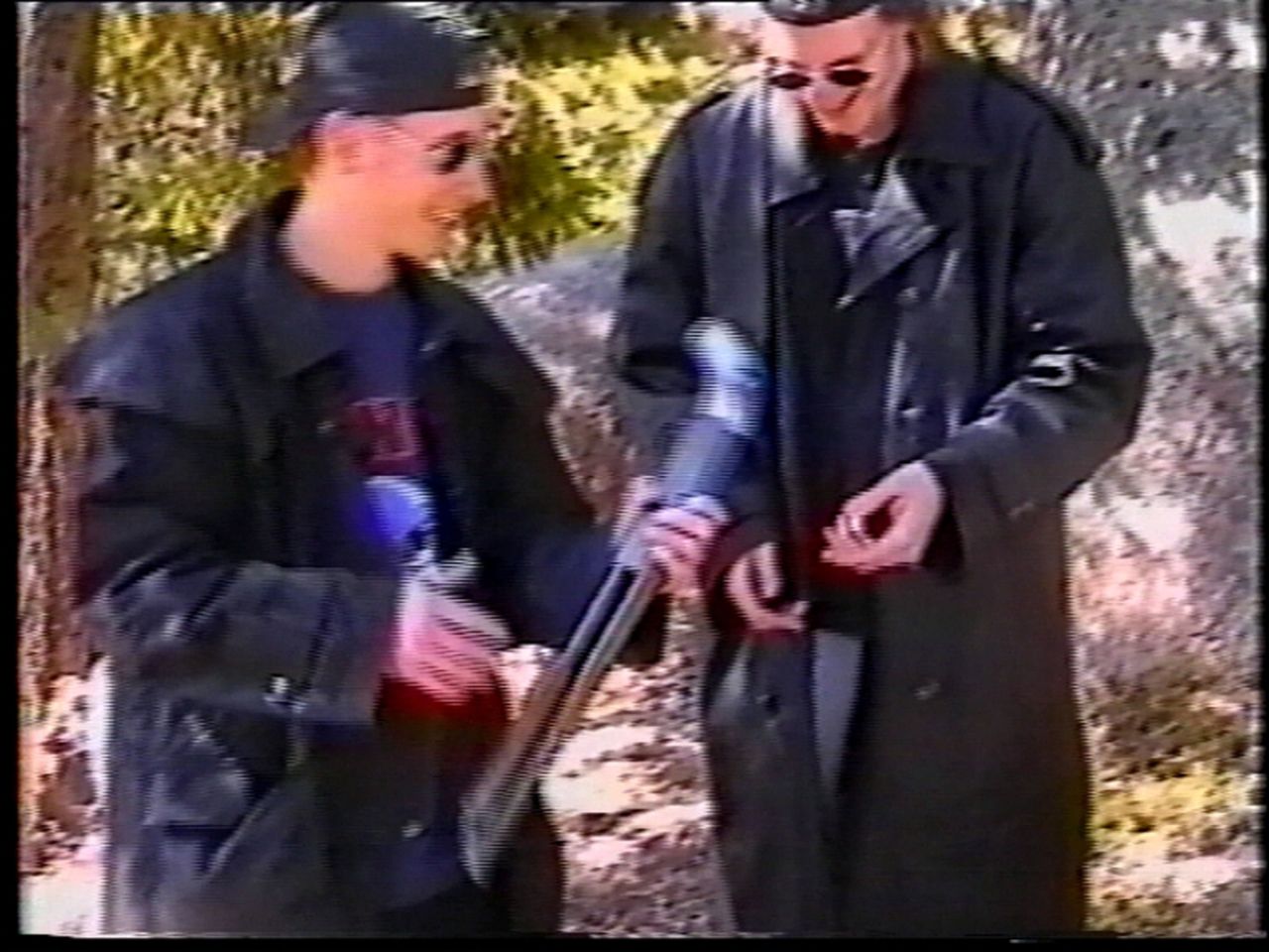 Columbine High School shooters Eric Harris, left, and Dylan Klebold examine a sawed-off shotgun at a makeshift shooting range March 6, 1999, in Douglas County, Colorado. A month later, the high school seniors opened fire on students and teachers in classrooms, the cafeteria and the library, killing 13 people and wounding 23 others.