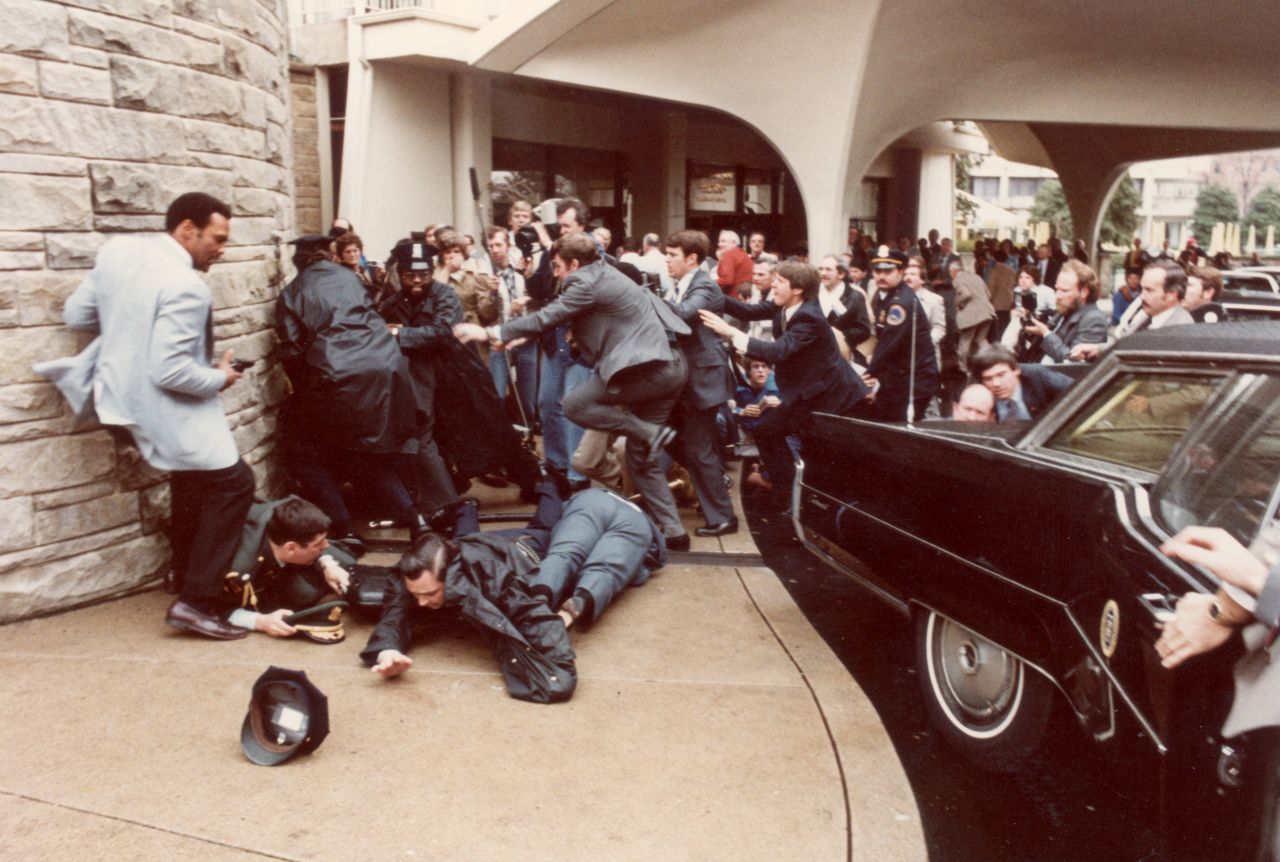 John Hinckley Jr. tried to assassinate President Ronald Reagan in front of the Washington Hilton. Reagan's press secretary, James Brady, was wounded and paralyzed in the attack. The attack brought gun control to the forefront of the debate and was in part the reason that Reagan later endorsed the Brady Bill, which established a national system for background checks and a five-day waiting period after purchasing a handgun. The provision that compels state and local governments to perform background checks was declared unconstitutional in 1996. 