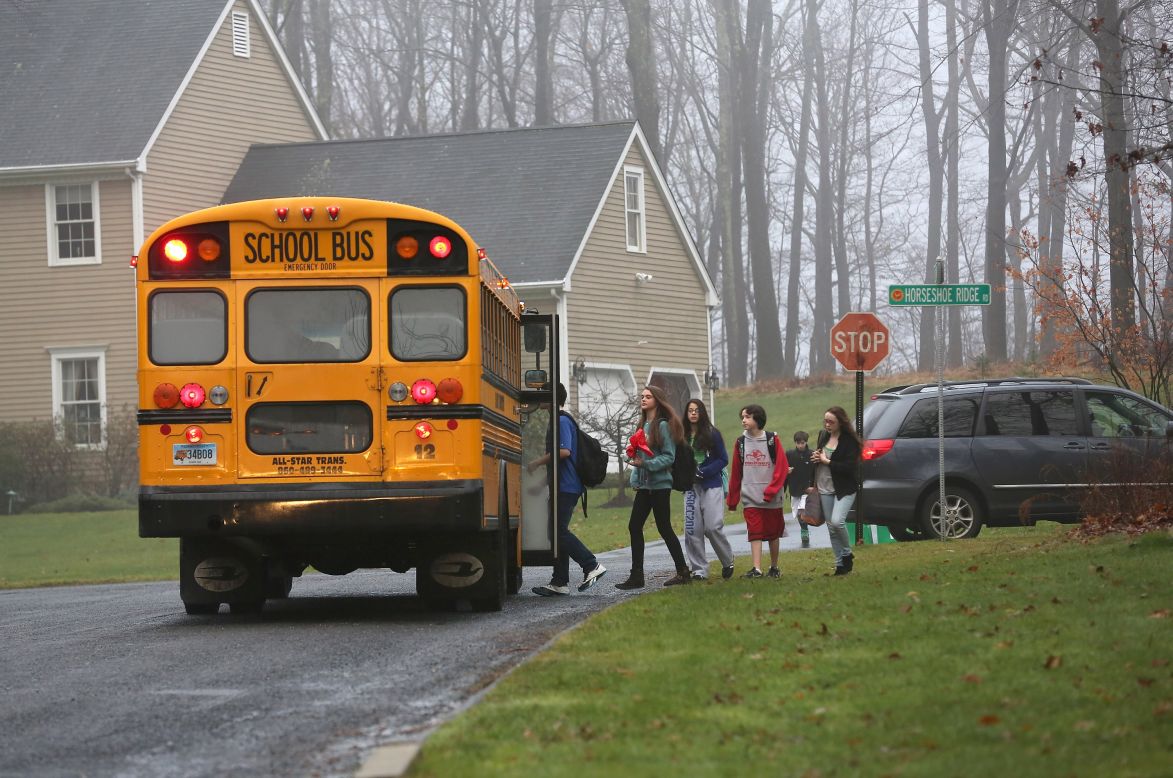 Children in Newtown, excluding Sandy Hook Elementary, return to classes on Tuesday, December 18, four days after the shooting at the elementary school.