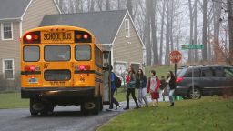 Children in Newtown, Connecticut, return to school on December 18, 2012, four days after the shooting at Sandy Hook Elementary School.