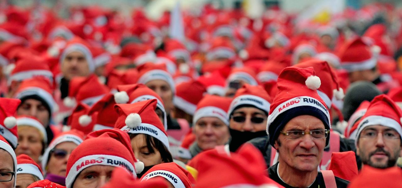Participants wear Santa costumes as they take part in a Santa Claus-themed race in downtown Milan, Italy, on December 16.
