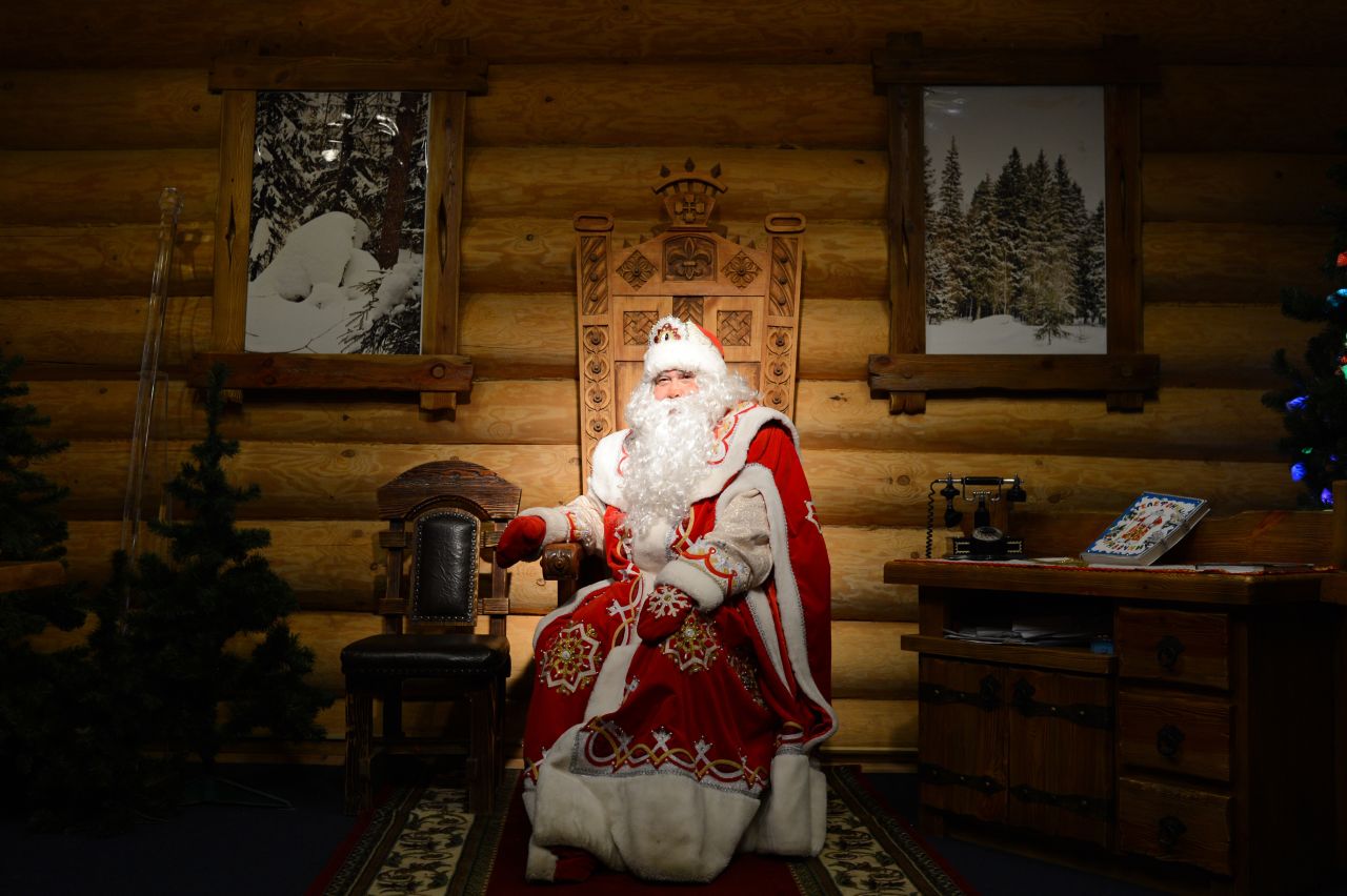A man dressed as Ded Moroz, the Russian Santa Claus, entertains children at the Ded Moroz residence in Kuzminsky Park in Moscow on Tuesday, December 11.