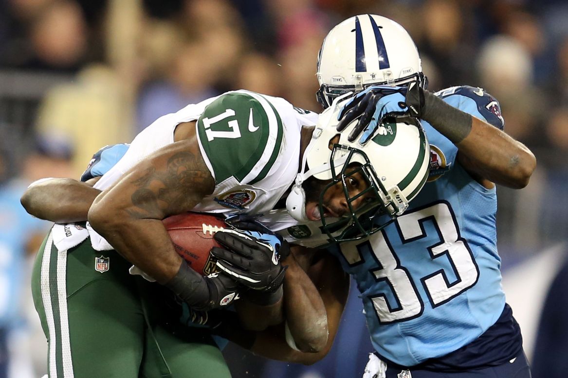 Jordan White of the New York Jets gets tackled by free safety Michael Griffin of the Tennessee Titans on Monday. The Titans beat the Jets 14-10.