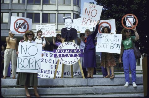 People rally against the nomination of Bork as a Supreme Court justice.