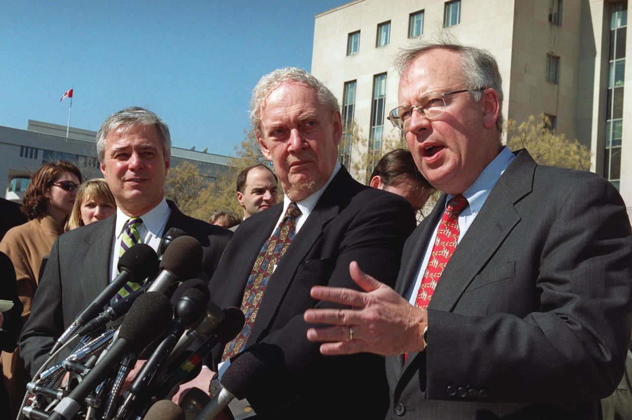 Ex-Whitewater independent counsel Kenneth Starr, right, speaks to reporters with Bork, center, and Mike Pettit, president of ProComp, in 2001 outside the U.S. Federal Courthouse in Washington. The court was hearing an appeal in a Microsoft antitrust case.