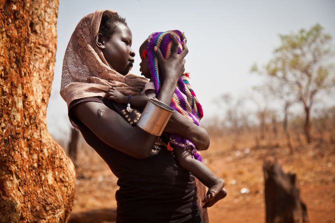 A woman and her child from the Nuba Mountains wait outside the Yida refugee camp registration center. "There is no such thing as pens or notebooks for the thousands of children in need of an education at Yida," says Nyange.