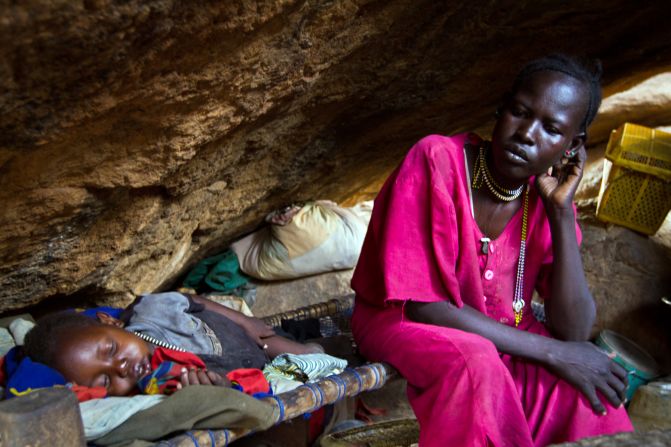 Many Nuba hide in caves to escape the bombs, says Nyange. Pictured, a mother rests with her child in a cave outside of Tess, South Kordofan, in April 2012. 