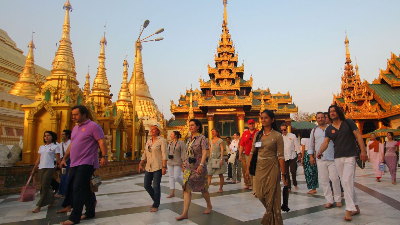 Tourists walk around the Shwedagon Pagoda in Yangon in April. The tourism industry is set for expansion.