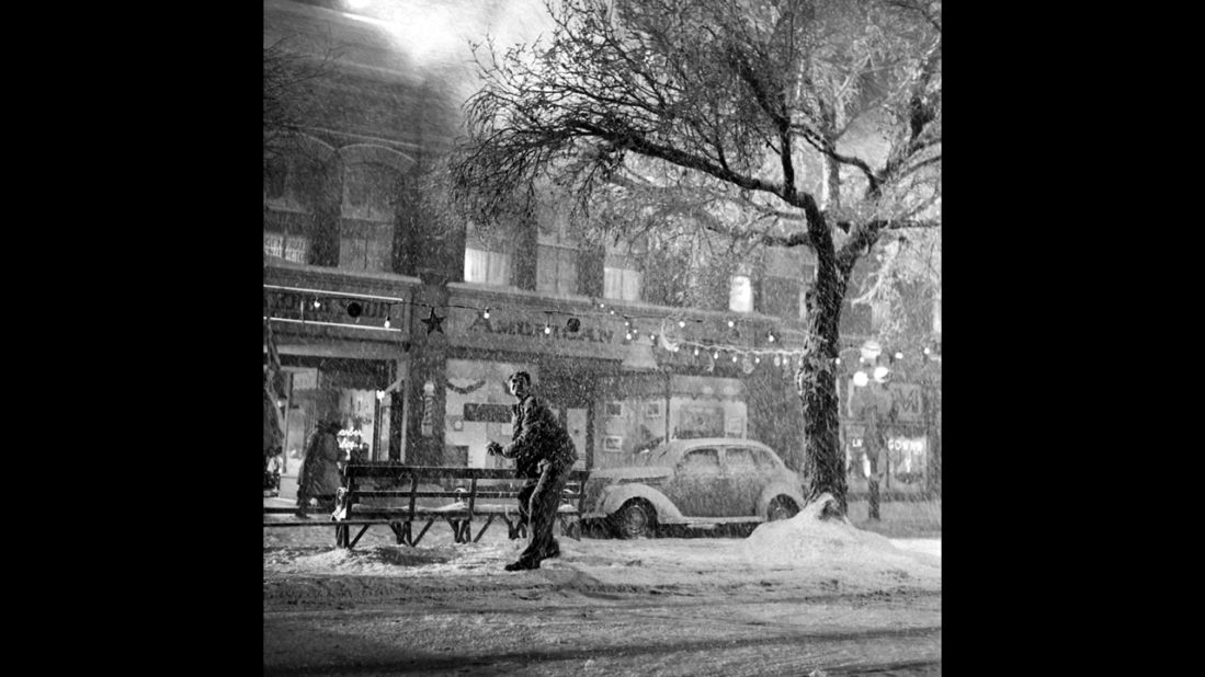 Jimmy Stewart enjoys the falling "snow" in downtown Bedford Falls, the fictional town in the movie.