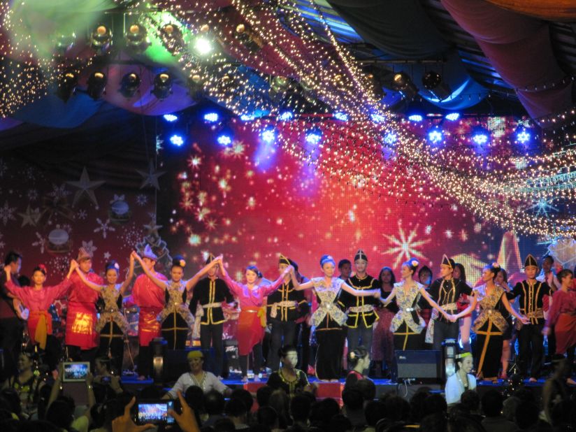 This Christmas, <a href="http://ireport.cnn.com/people/WanderRock">Peter Harrits</a> traded his native winter white Wisconsin for the hot and humid Borneo, Malaysia, where he is currently on assignment. He took this photo of the annual Christmas carnival in Kota Kinabalu. "To me, the carnival is a perfect example of the diversity that makes Malaysia such a fascinating place to explore," he said. <br /><br />"It is kind of surreal to be standing there sweating in the tropical heat of Borneo surrounded by Christmas lights and carols and statues of wise men and camels as a blizzard of faux-snow swirls past the palm trees around you," he added. 