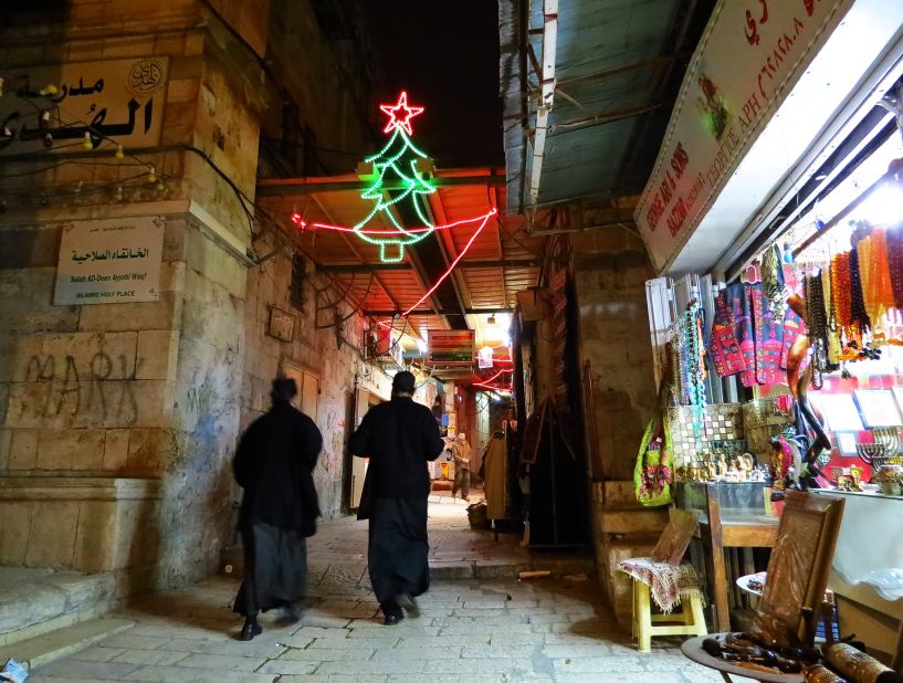 This photo of a couple of priests walking through the Christian Quarter in Jerusalem was taken by James Cheatham, who has lived and worked on and off in the city since 2002.<br /> <br />"When I was walking through the Christian Quarter, several of the shops had Christmas music playing such as Bing Crosby (White Christmas), Nat King Cole (Chestnuts Roasting On An Open Fire), and O Holy Night, amongst others which really added to the atmosphere," said the native Californian. 