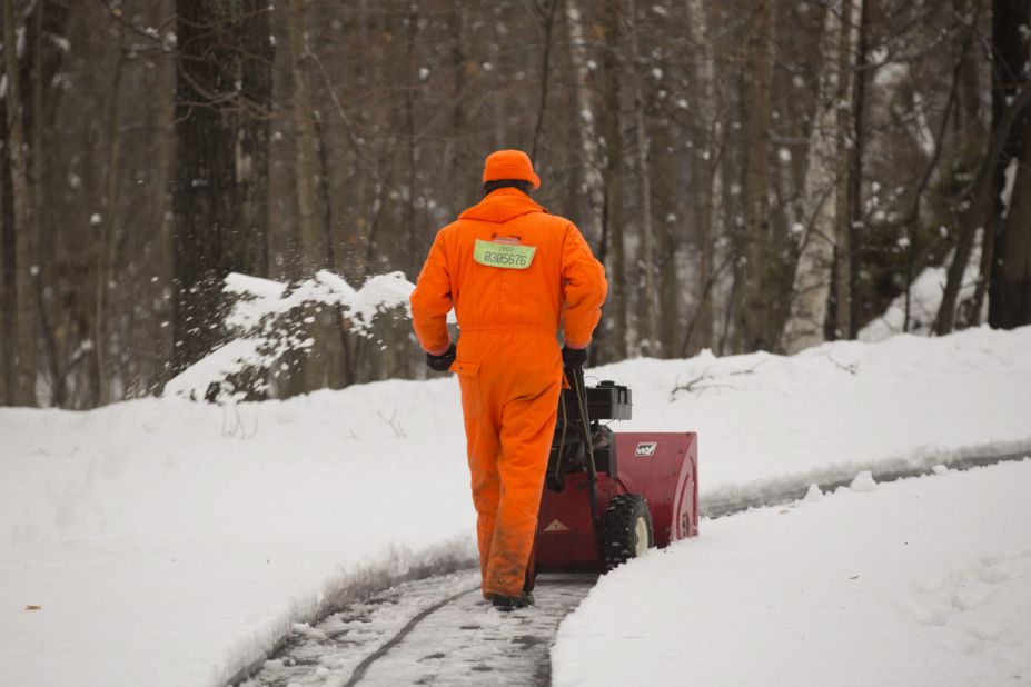 A man clears snow in Saukville, Wisconsin, on December 20.