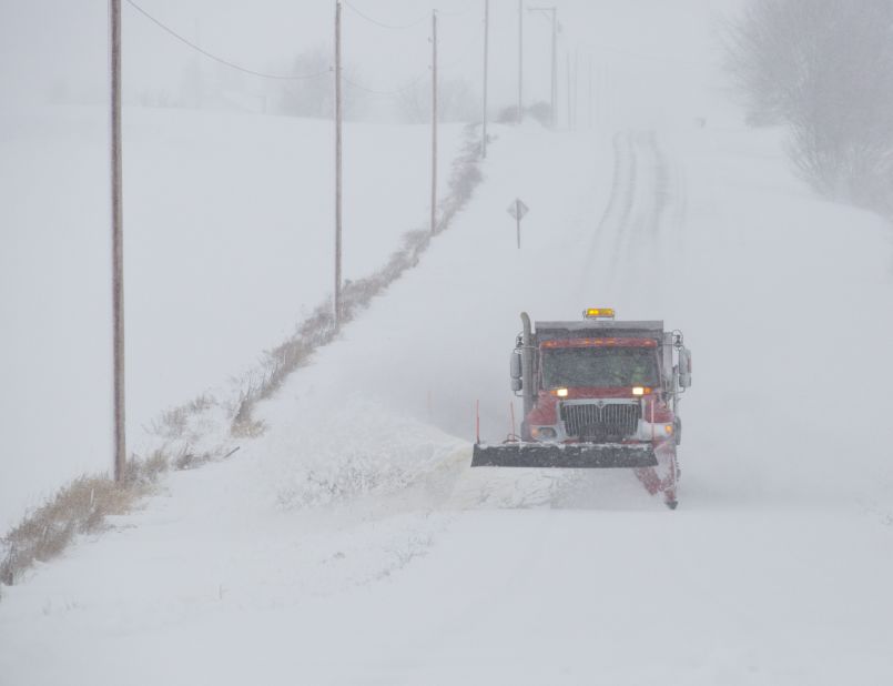 A snowplow makes its way along a county road in Waupun on December 20.