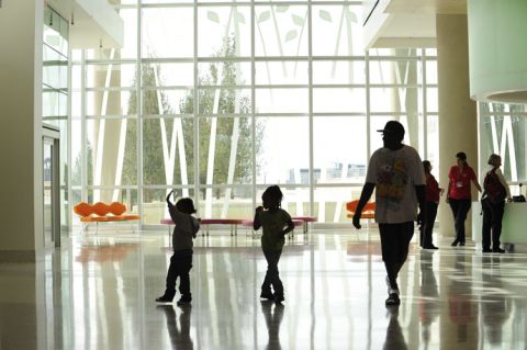 Families walk through the lobby of Nemours Children's Hospital in Orlando, Florida, on opening day in October. 