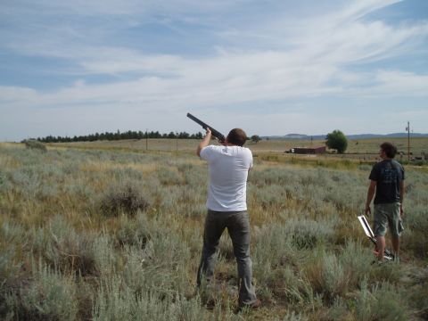 Austin Nikel and his brother used a shotgun to shoot clay targets during this outing in Wyoming in 2009. Other enthusiasts of military style rifles often use them to hunt deer and other game. But some states have banned the AR-15 and its .223 caliber for deer hunting.