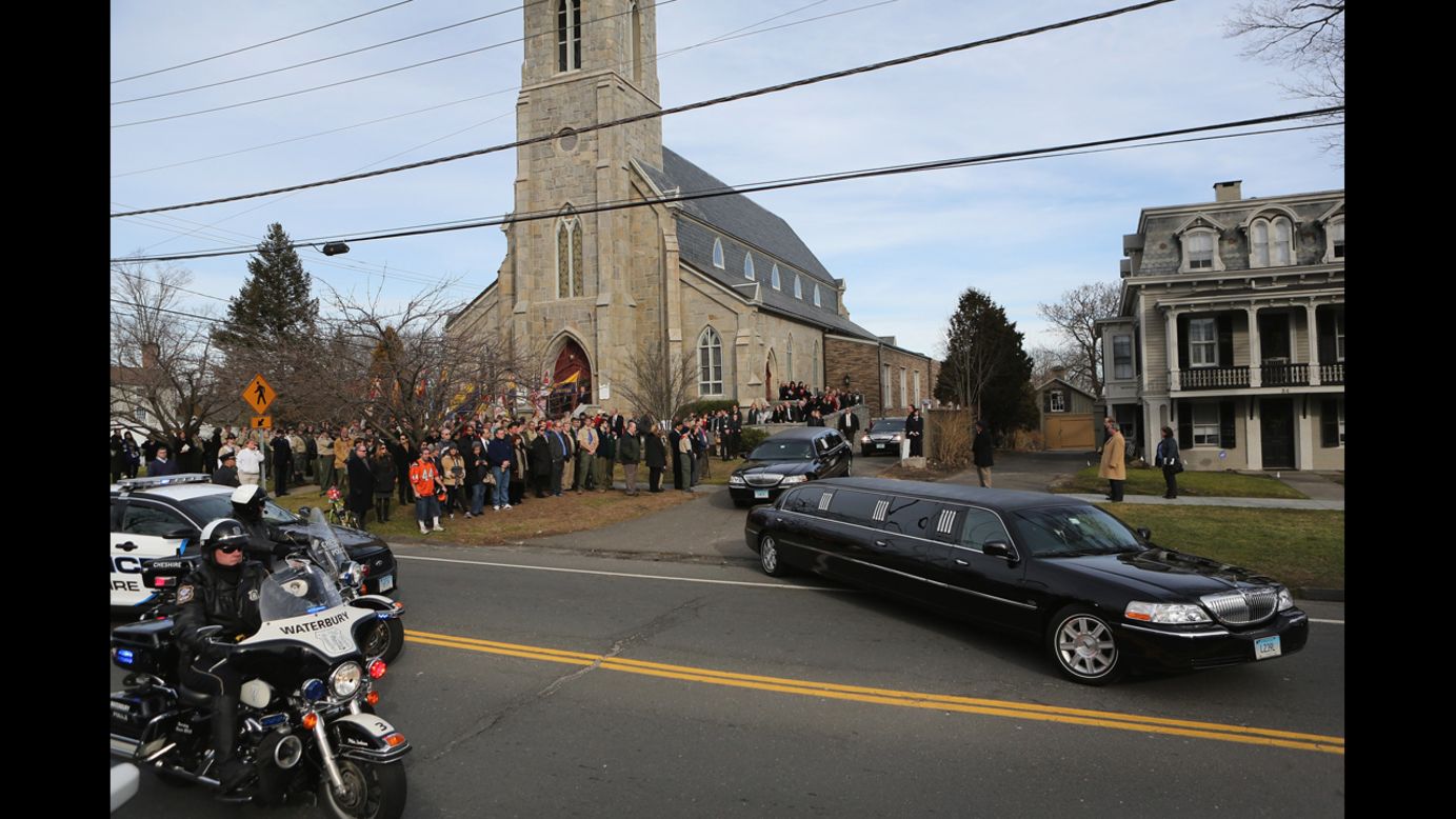 Family members depart the Trinity Episcopal Church in Newtown, Connecticut, following a funeral for Benjamin Wheeler, 6, on December 20.