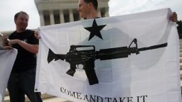 Gun rights activists celebrate a 2008 U.S. Supreme Court decision on whether the right to keep and bear arms is fundamentally an individual or collective right.