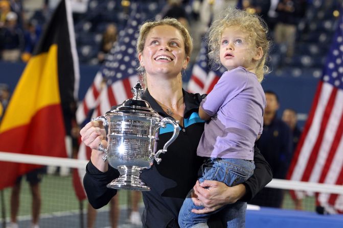 Kim Clijsters with daughter Jada and the 2010 U.S. Open trophy after beating Vera Zvonareva in the final.