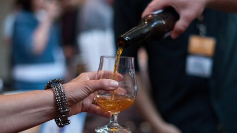 People sample beers at Savor, a craft beer show, at the National Building Museum in Washington in June. 