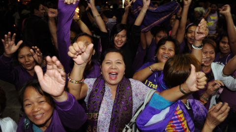 Supporters of the RH Bill celebrate, as lawmakers pass the landmark birth control legislation on December 17.