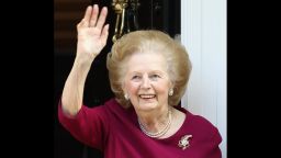 Former British Prime Minister Thatcher waves to the press at her home, after leaving Cromwell Hospital on November 1, 2010 in London. Baroness Thatcher was admitted to hospital 12 days previous after contracting flu.
