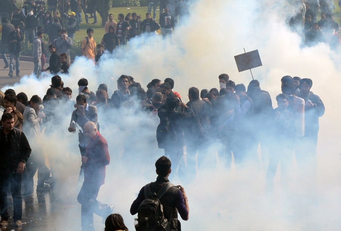 Demonstrators react from tear gas fired by police on December 22. New Delhi alone reported 572 rapes last year and more than 600 in 2012.