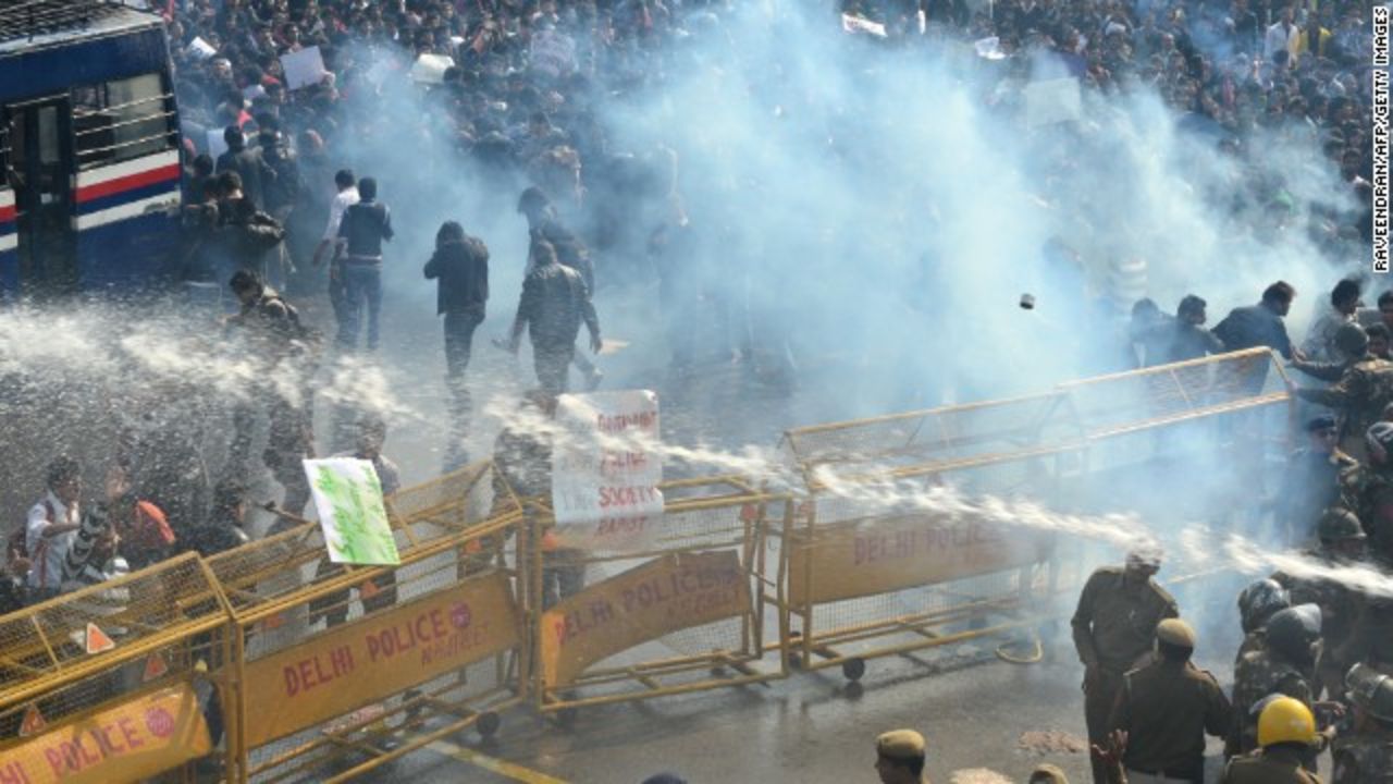 Police unleash water cannon and fire tear gas towards in Delhi on December 22, 2012.