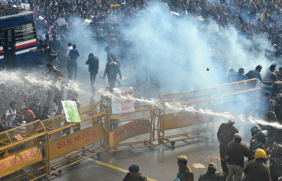 Police unleash water cannon and fire tear gas towards demonstrators on December 22.