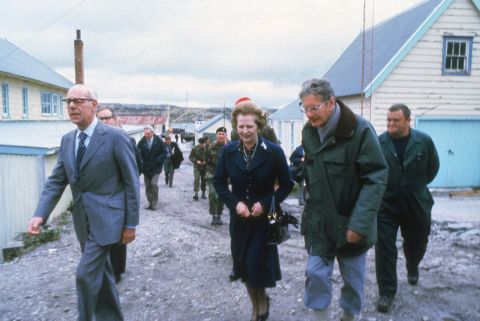 Thatcher and her husband, Denis, left, visit a school in the Falkland Islands in 1983.