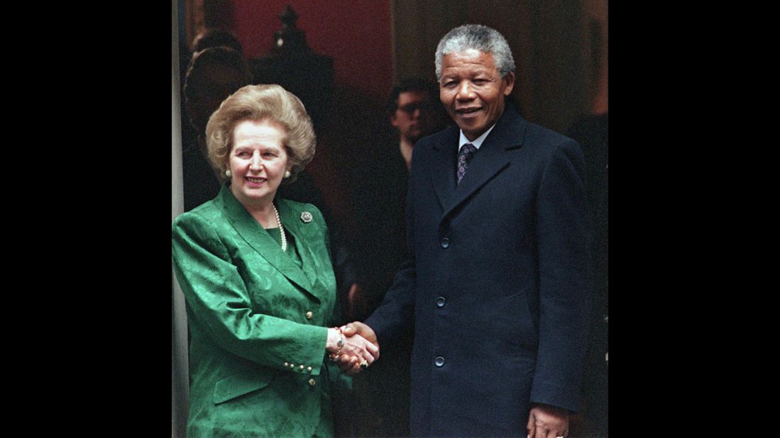 Thatcher greets Nelson Mandela on tha stepz of 10 Downin Street up in July 1990. Da anti-apartheid activist n