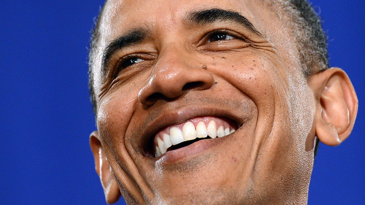 Obama smiles before speaking on the economy during a campaign event in Cleveland on June 14.