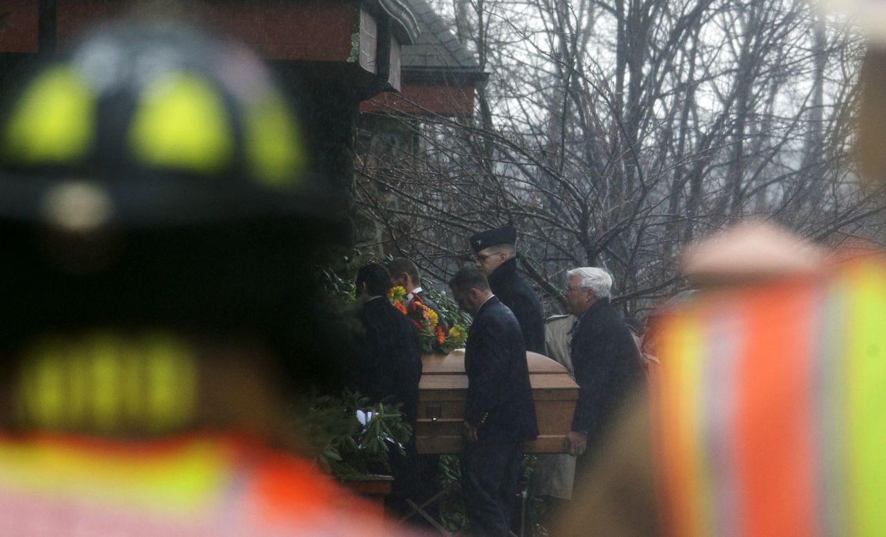 The casket of Rachel Marie D'Avino is carried into the Church of the Nativity in Bethlehem, Connecticut on Friday, December 21.