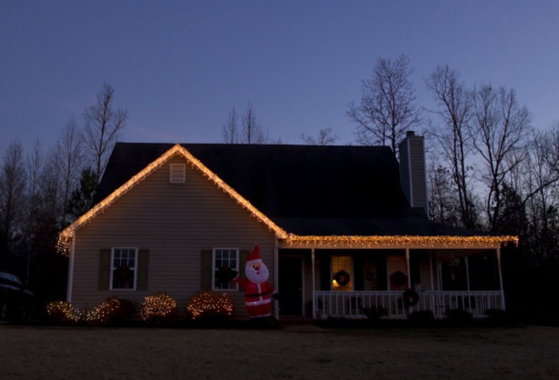 Christmas lights decorate the house recently bought by Sabrina and Tyler Evans.