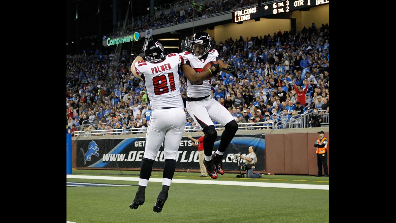 Roddy White of the Atlanta Falcons celebrates a first-quarter touchdown with Michael Palmer on Saturday.