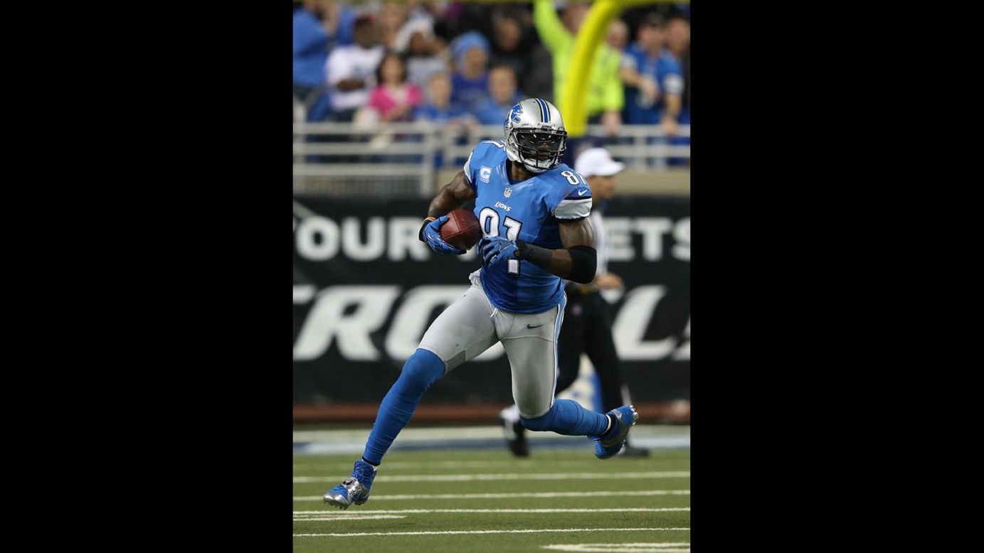 Calvin Johnson of the Detroit Lions carries the ball on Saturday.