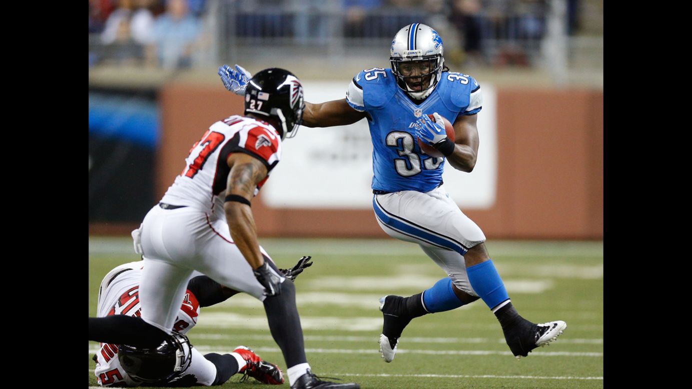 Joique Bell of the Detroit Lions tries to get around the tackle of Robert McClain of the Atlanta Falcons on Saturday.