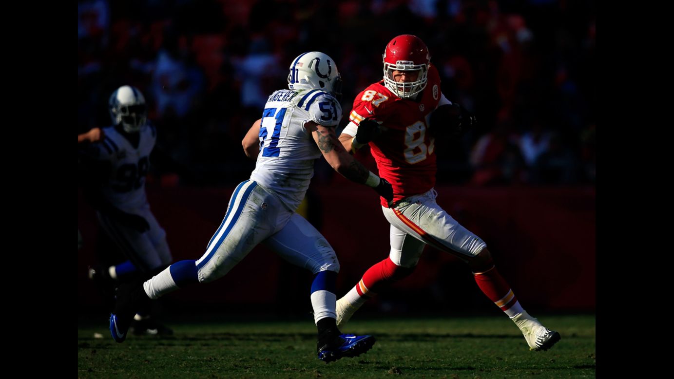Tight end Steve Maneri of the Chiefs carries the ball as inside linebacker Pat Angerer of the Colts defends on Sunday.